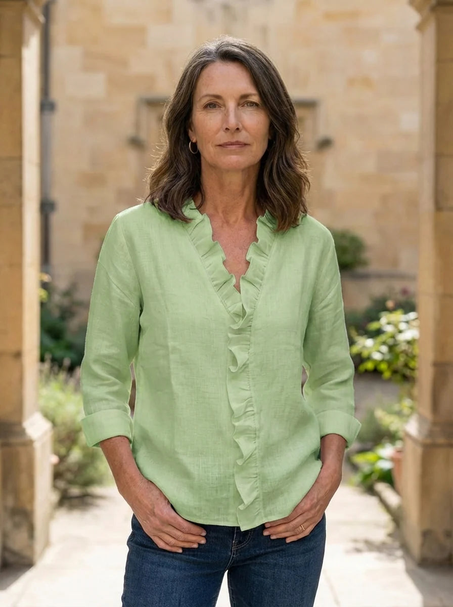 Caterina Ruffled V-Neck Casual Blouse - three-quarter angle view highlighting ruffle trim