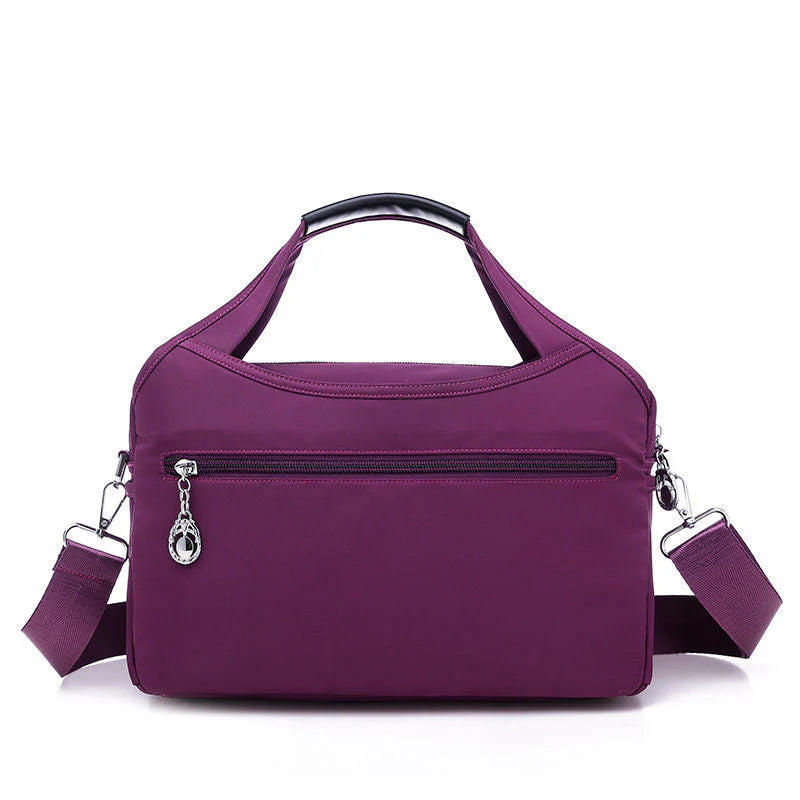 VaultChic Elegant Anti-Theft Tote Bag - close-up of branded logo and quality stitching