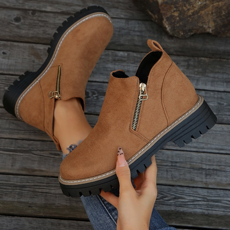 ZipStryde Sleek Zip Ankle Boots - woman standing wearing sleek zip ankle boots outdoors